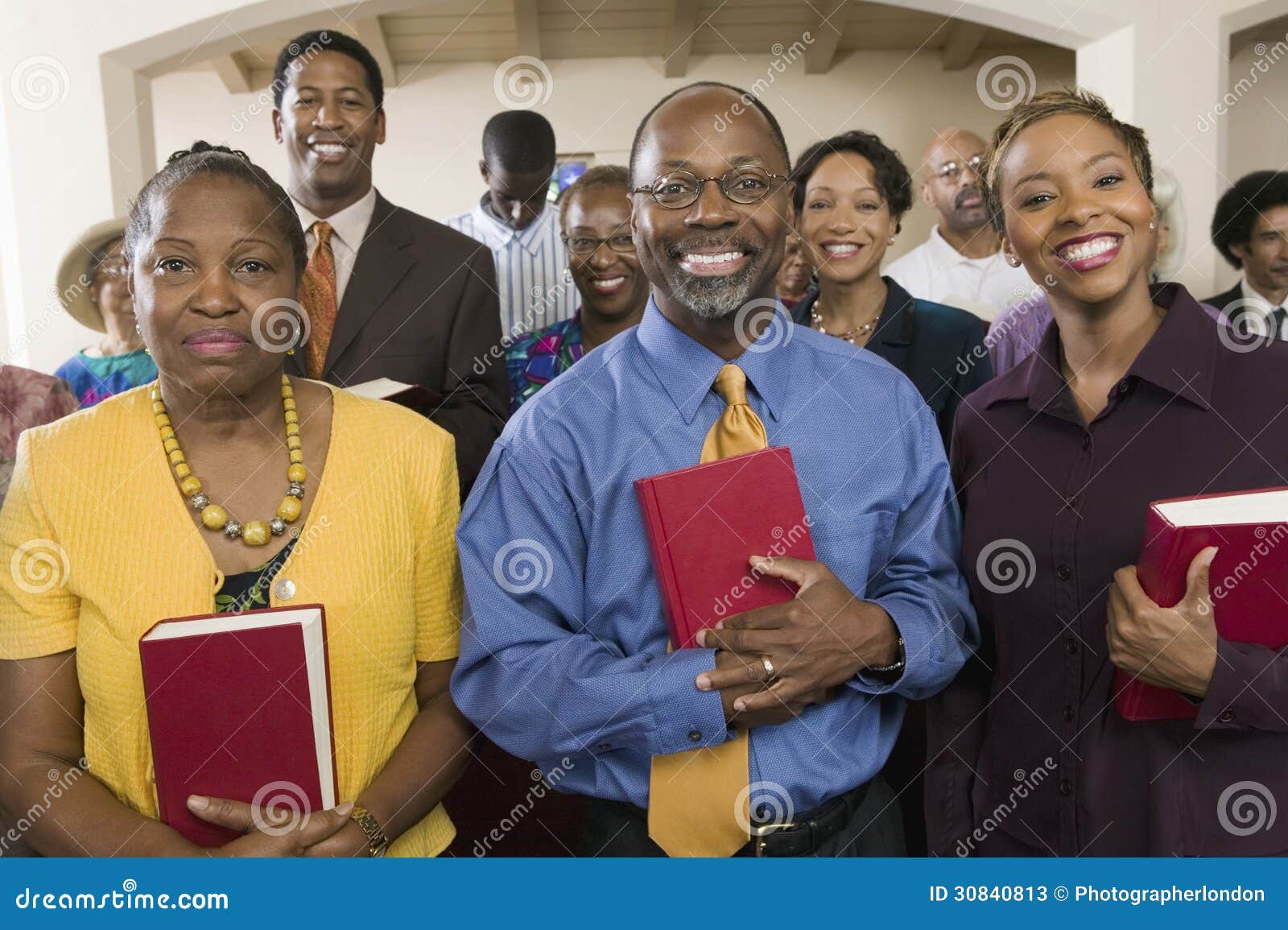 african american people with bibles in church