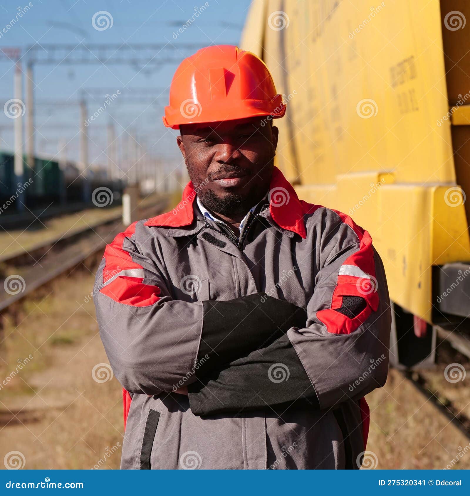 Railroad Man in Uniform and Red Hard Hat Look at the Camera Stock Image ...