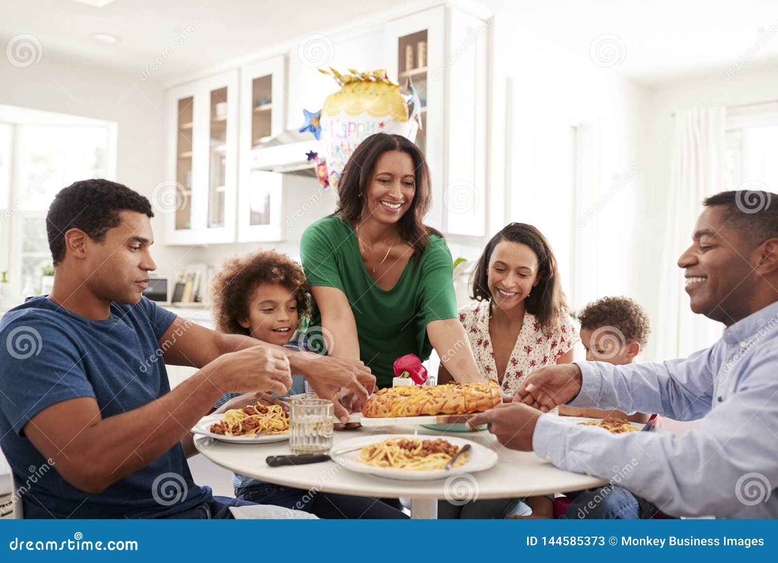 African American Three Generation Family Sitting Together at the ...