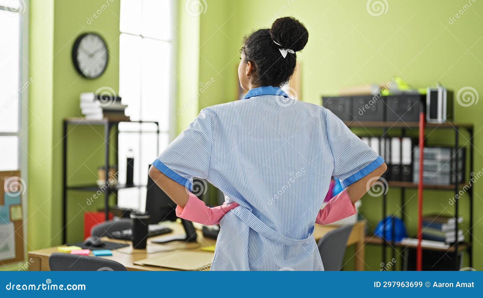 african american woman clean professional looking around backwards at street