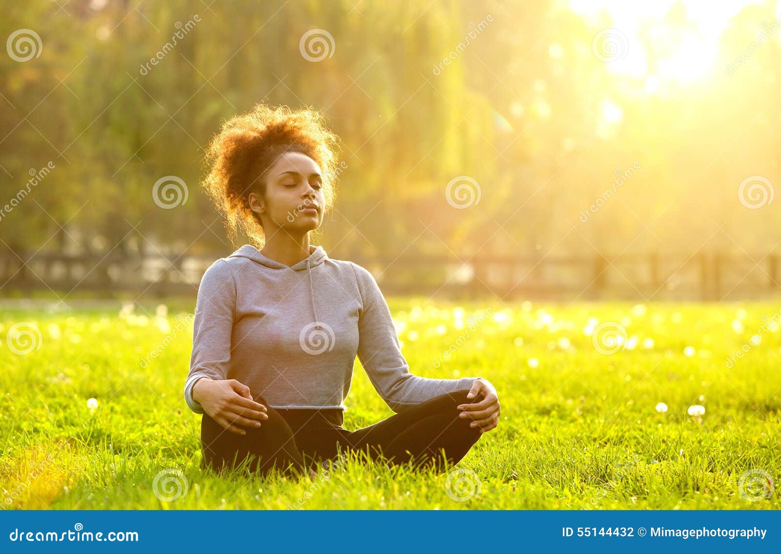 african american woman meditating in nature