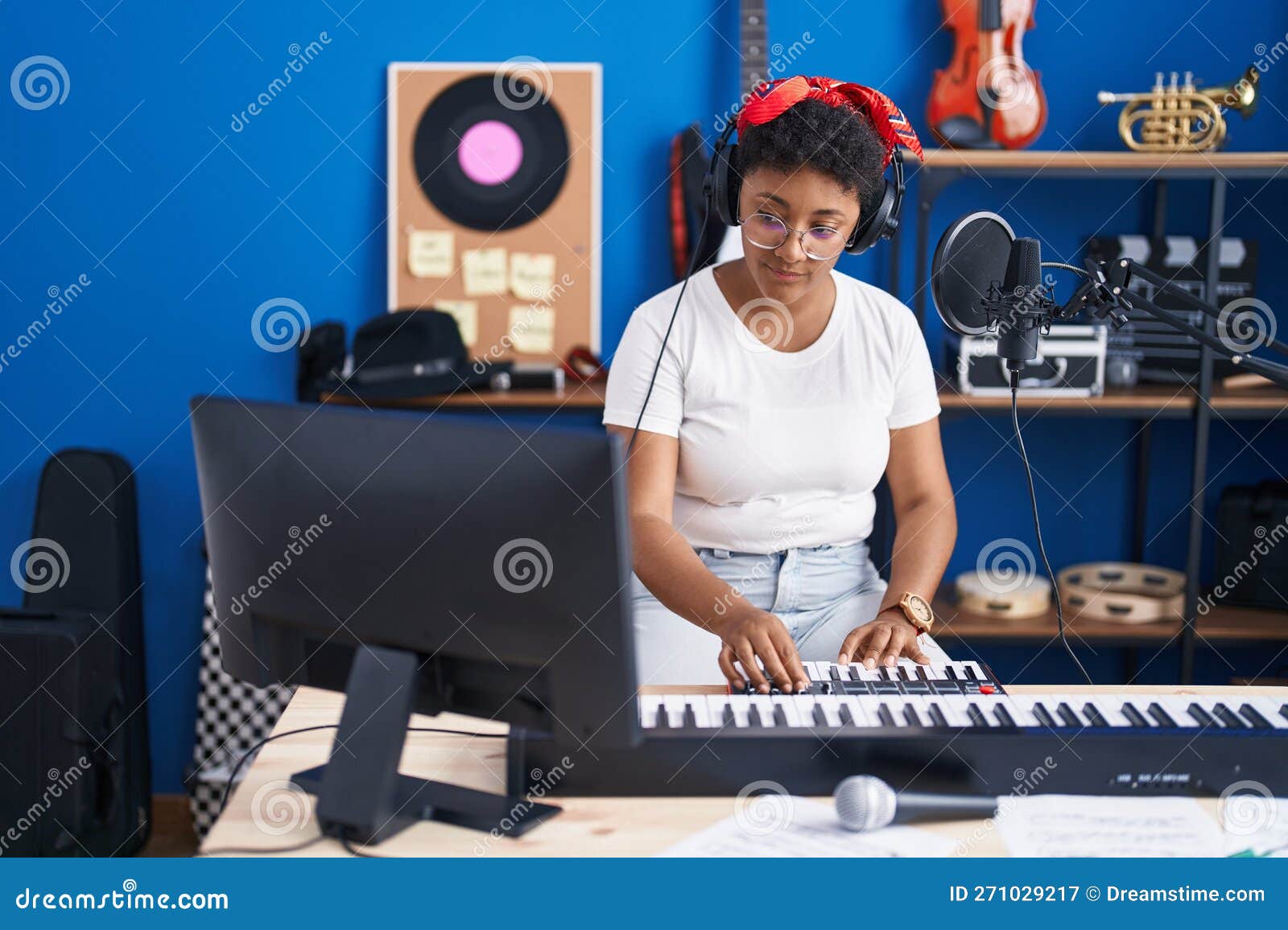 African American Woman Musician Playing Piano at Music Studio Stock