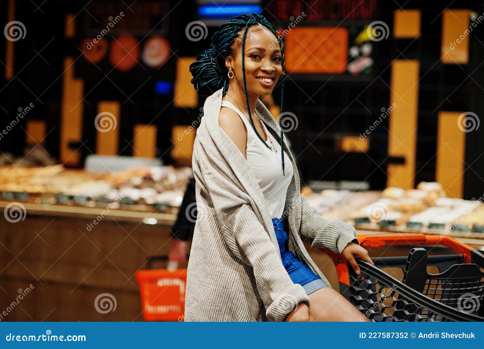 African American Woman with Shopping Cart Trolley in the Supermarket ...