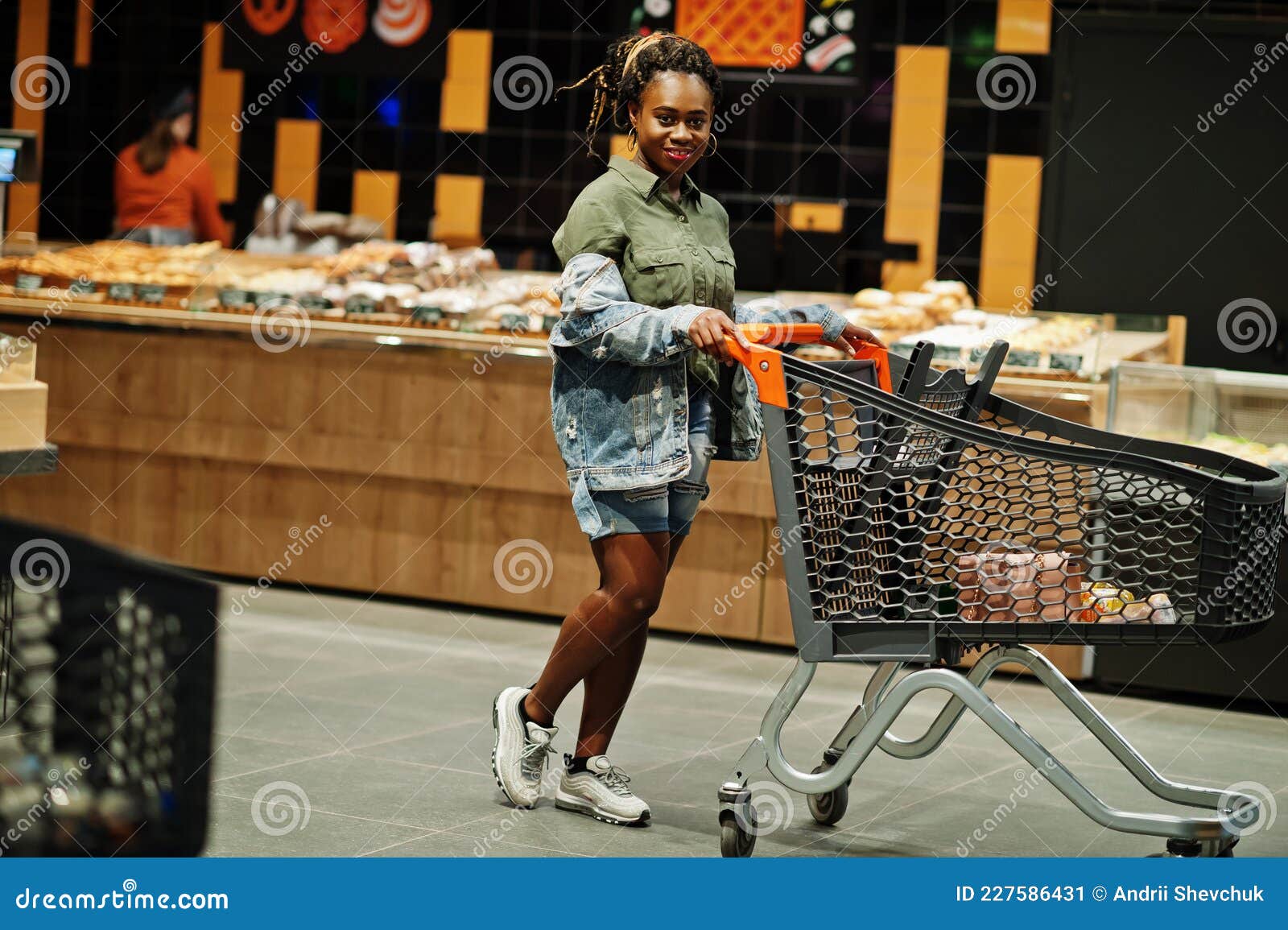 African American Woman with Shopping Cart Trolley in the Supermarket ...