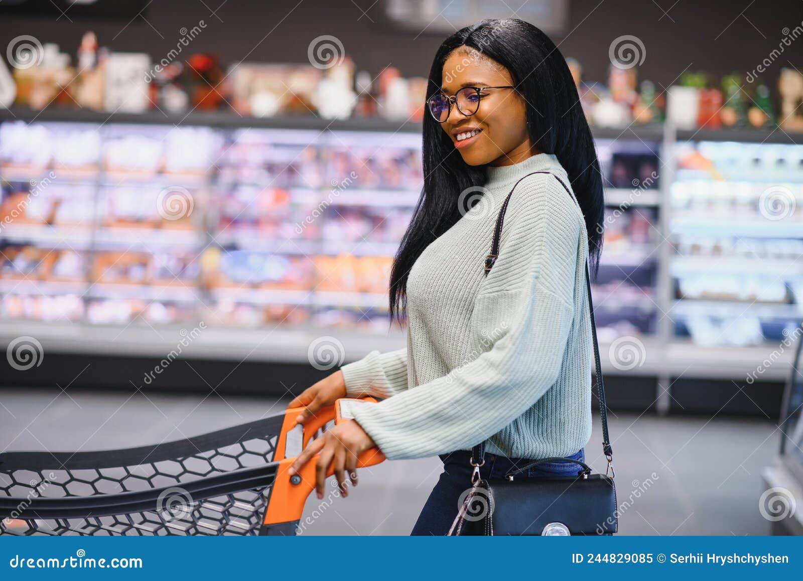 African American Woman with Shopping Cart Trolley in the Supermarket ...