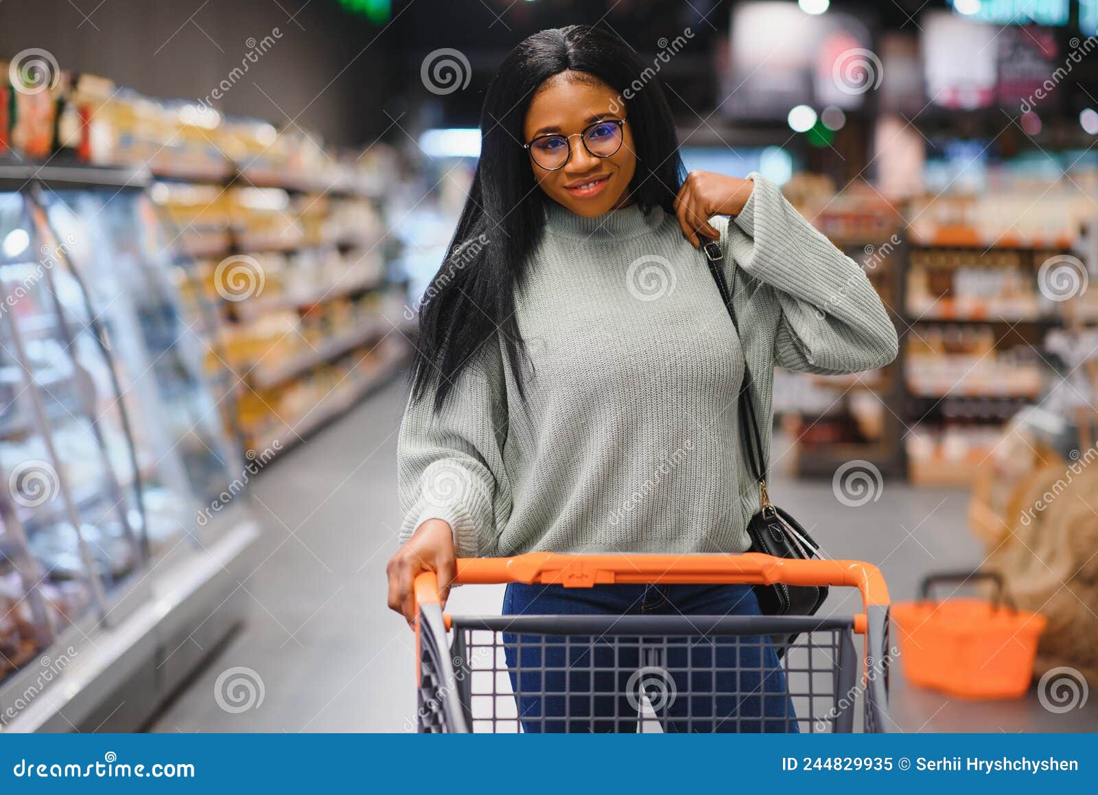 African American Woman with Shopping Cart Trolley in the Supermarket ...