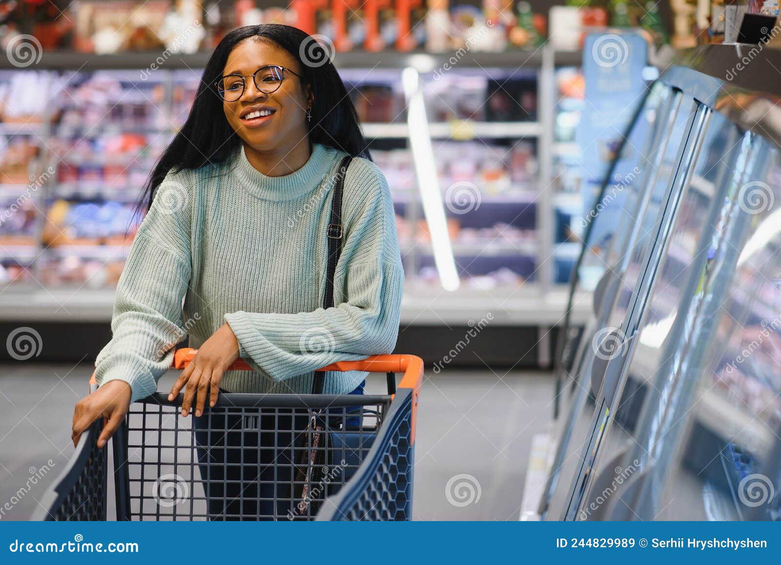 African American Woman with Shopping Cart Trolley in the Supermarket ...