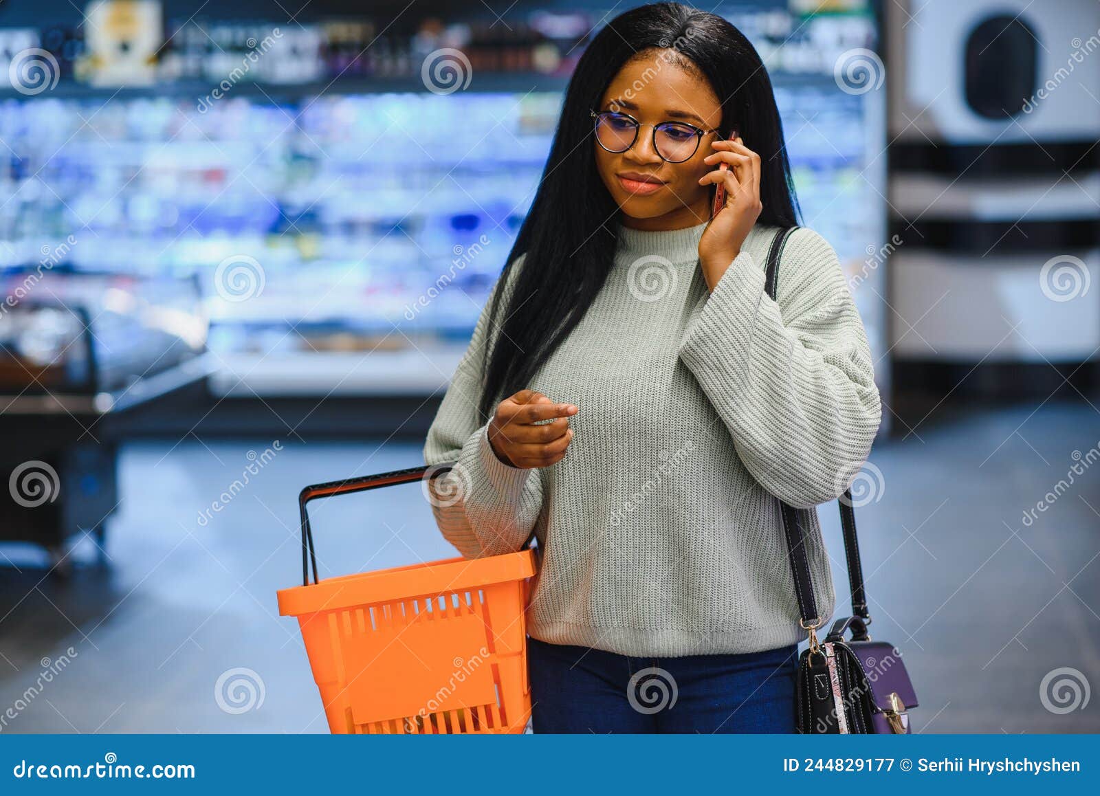 African American Woman with Shopping Cart Trolley in the Supermarket ...