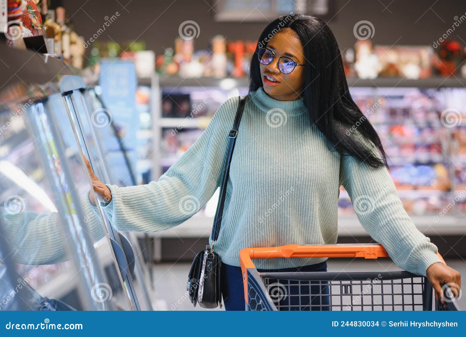 African American Woman at Supermarket with Shopping Cart Stock Photo ...