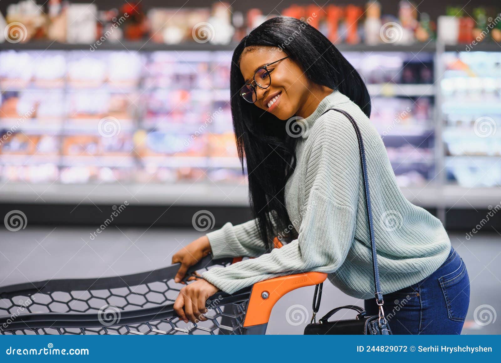 African American Woman at Supermarket with Shopping Cart Stock Photo ...