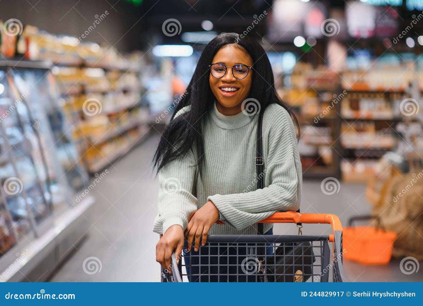 African American Woman at Supermarket with Shopping Cart Stock Image ...