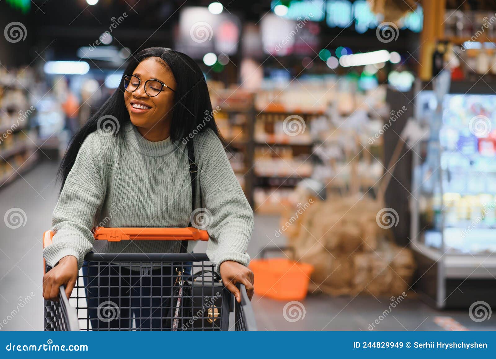 African American Woman at Supermarket with Shopping Cart Stock Image ...