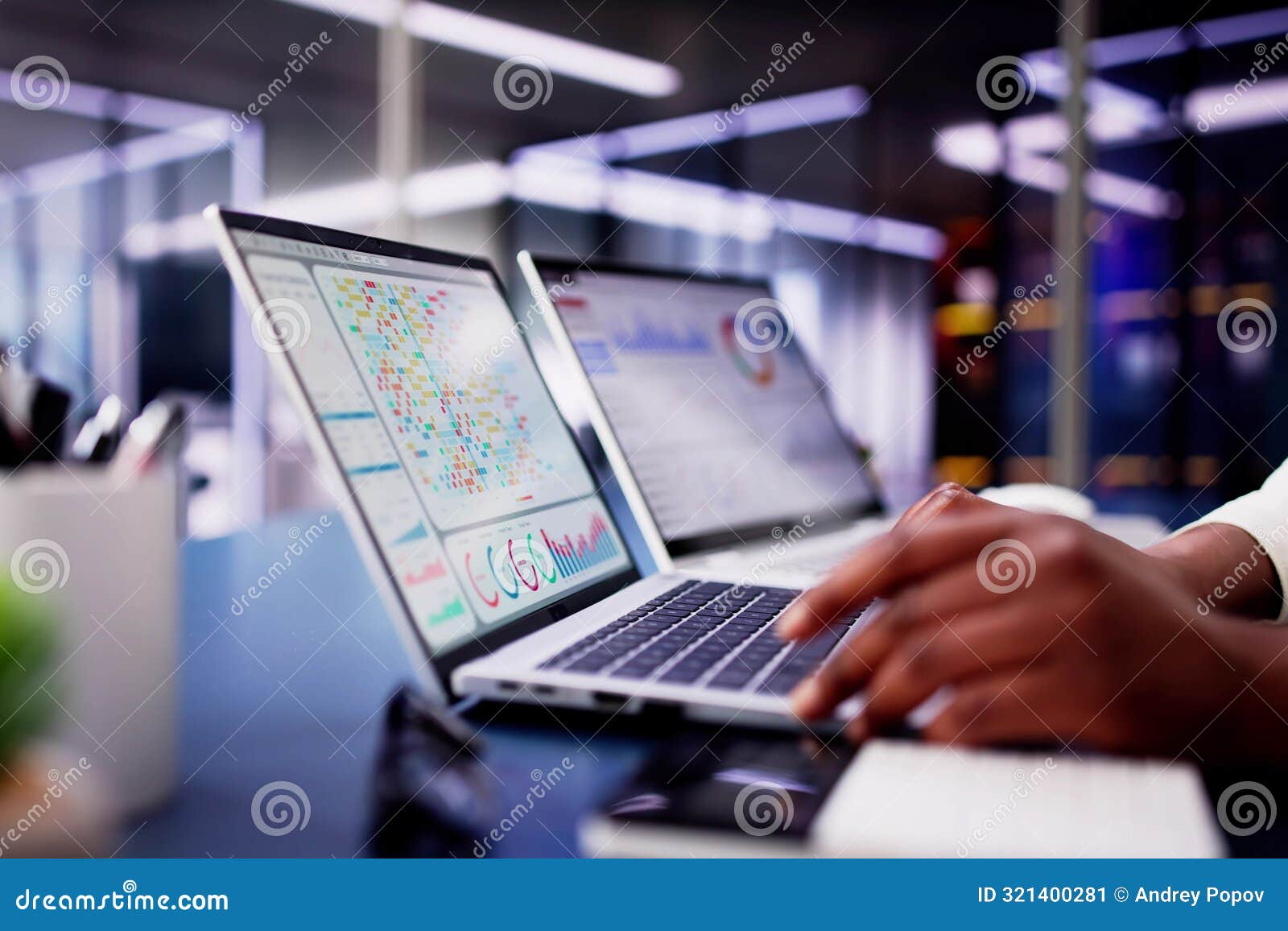 african american woman using virtual dashboard to predict emerging market trends in financial analytics