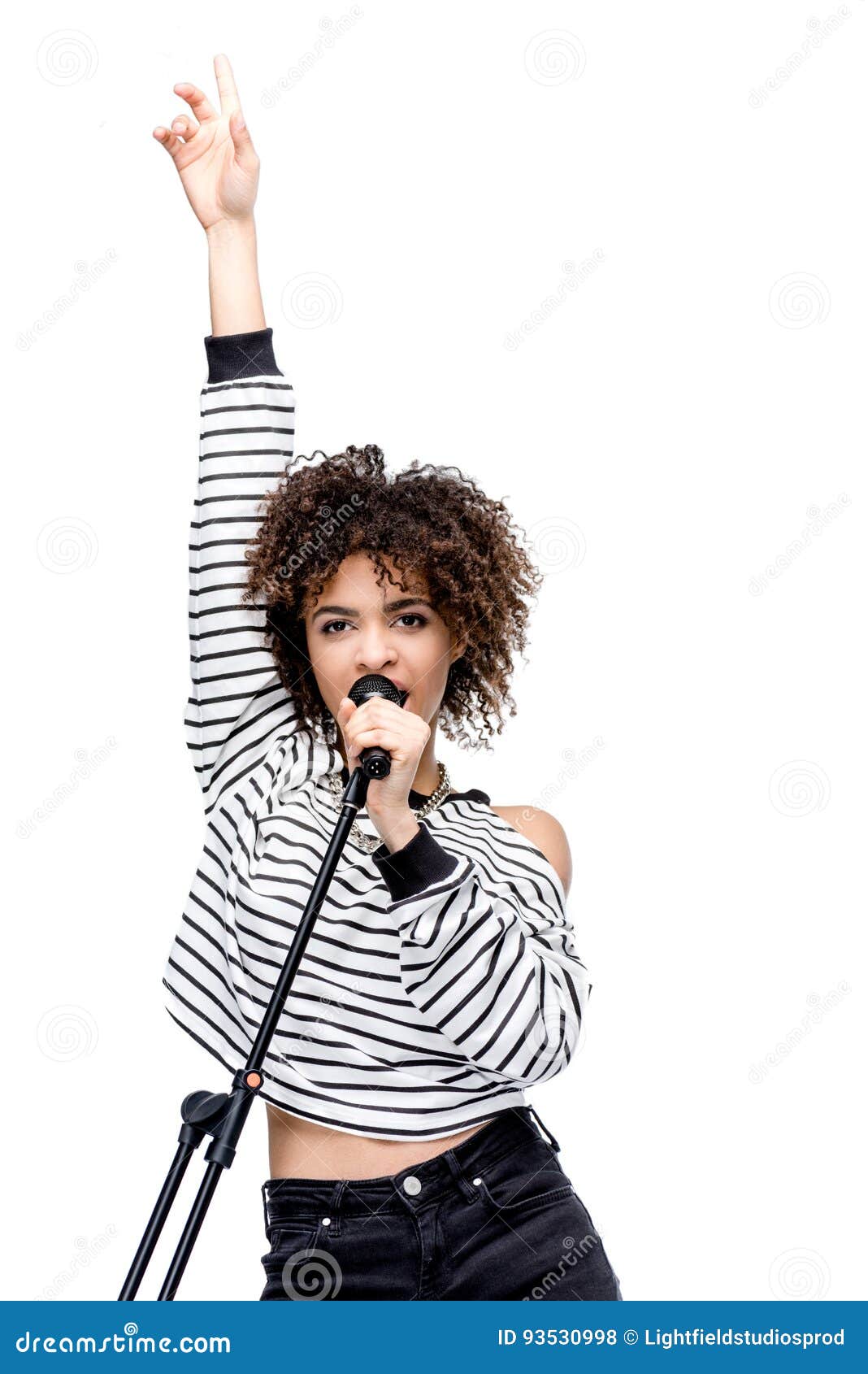 African American Young Woman Singing with Microphone Isolated on White ...