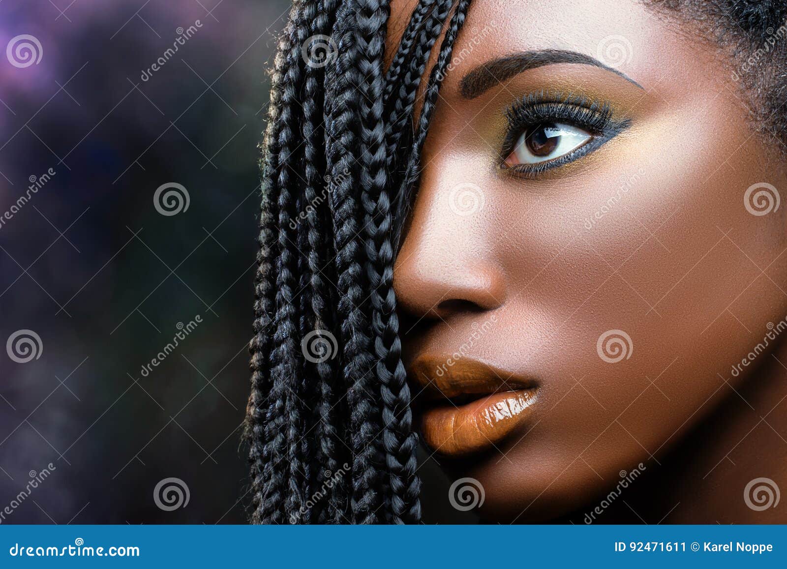 african beauty female face with braids .