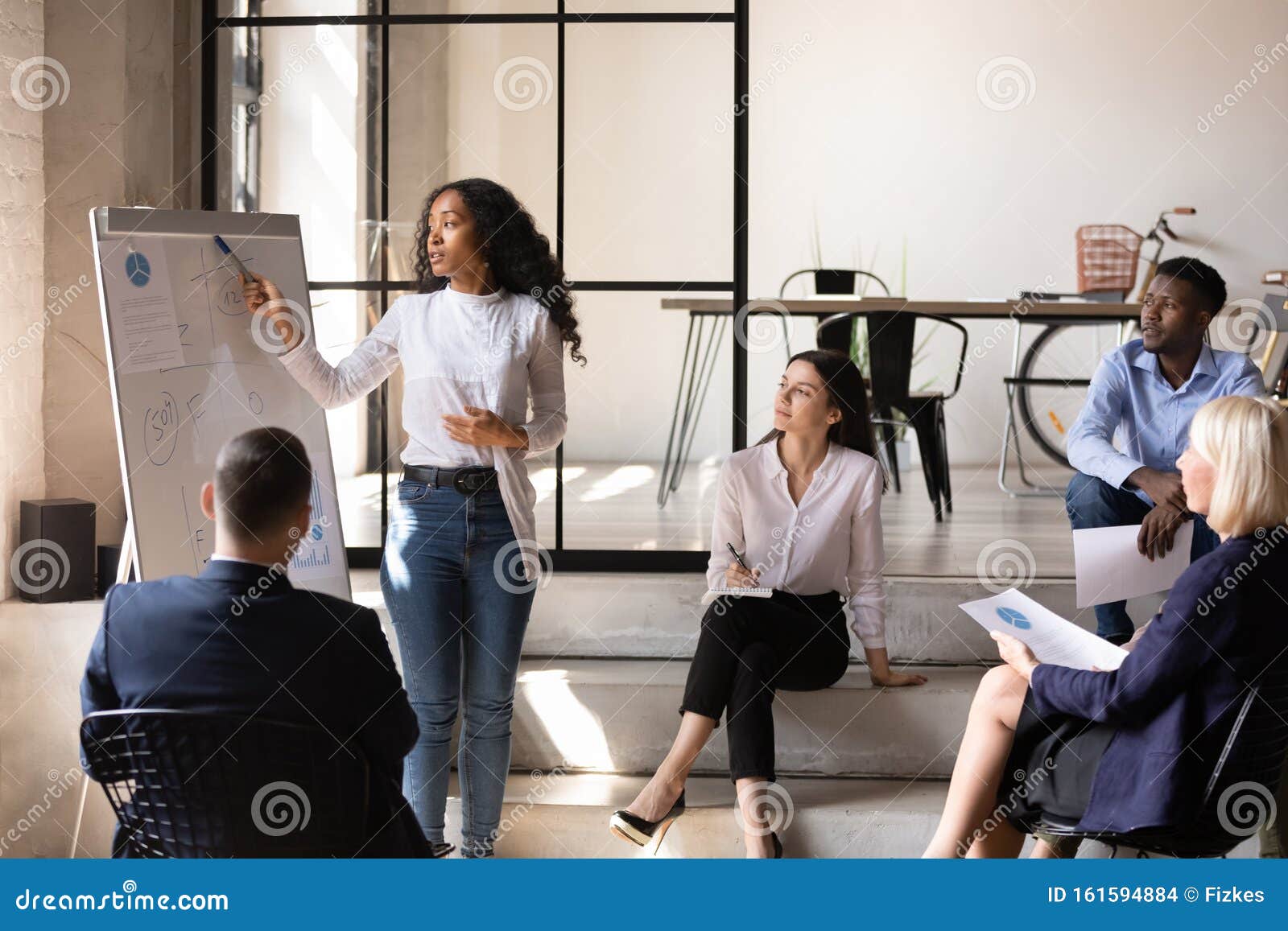 African Businesswoman Manager Give Presentation on Whiteboard at Office