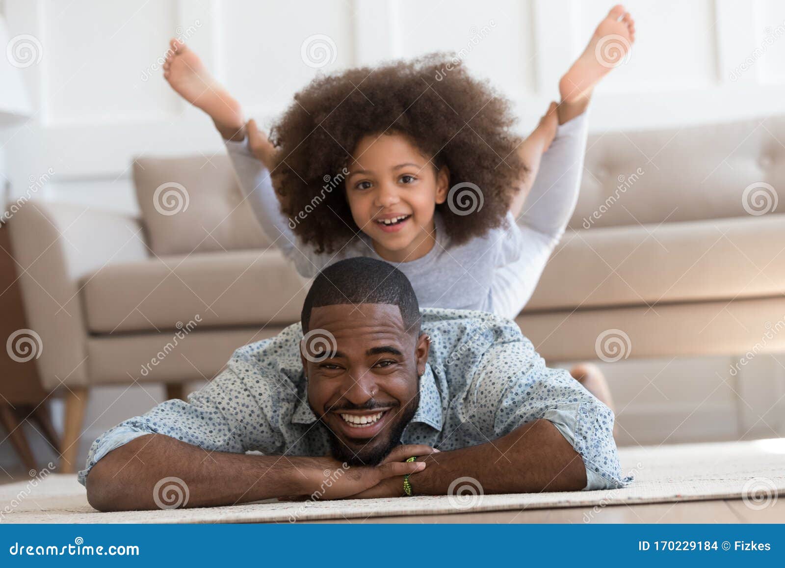 A father with small daughter pose in the window of their simple wooden home  near Macapa in Amapa State, Brazil Stock Photo - Alamy