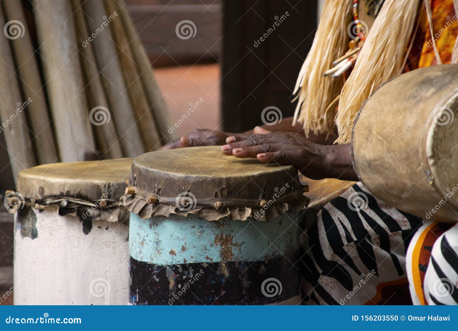 A African Drummer Playing on a Drum in Day Time. Stock Photo - Image of ...