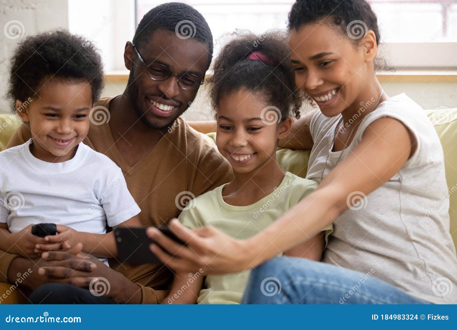 African Family with Kids Watching Funny Videos on Smartphone Stock Photo - Image of control, modern: 184983324 African Family with Kids Watching Funny Videos on Smartphone Stock Photo - Image of control, modern: 184983324