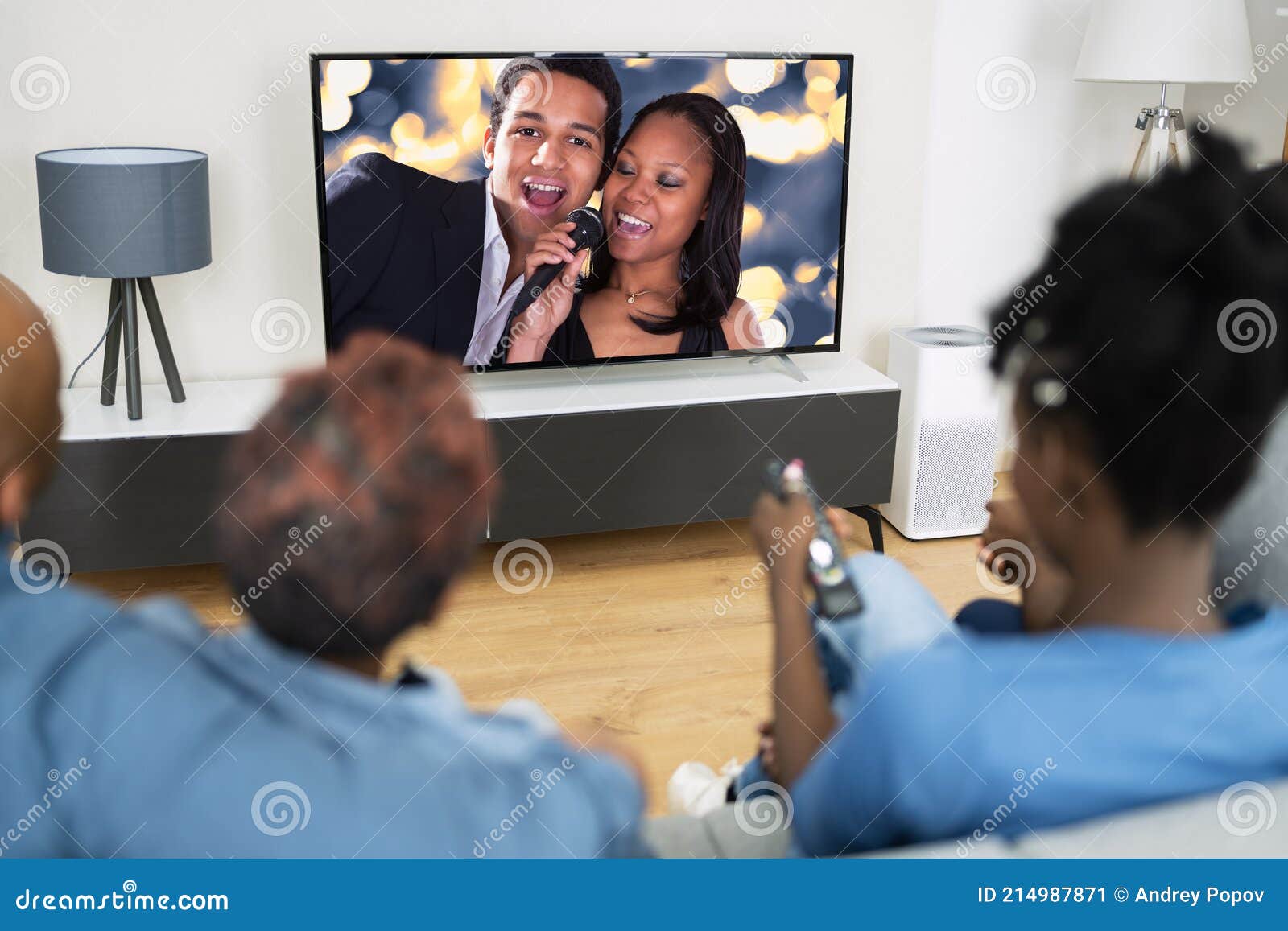 african family watching tv movie