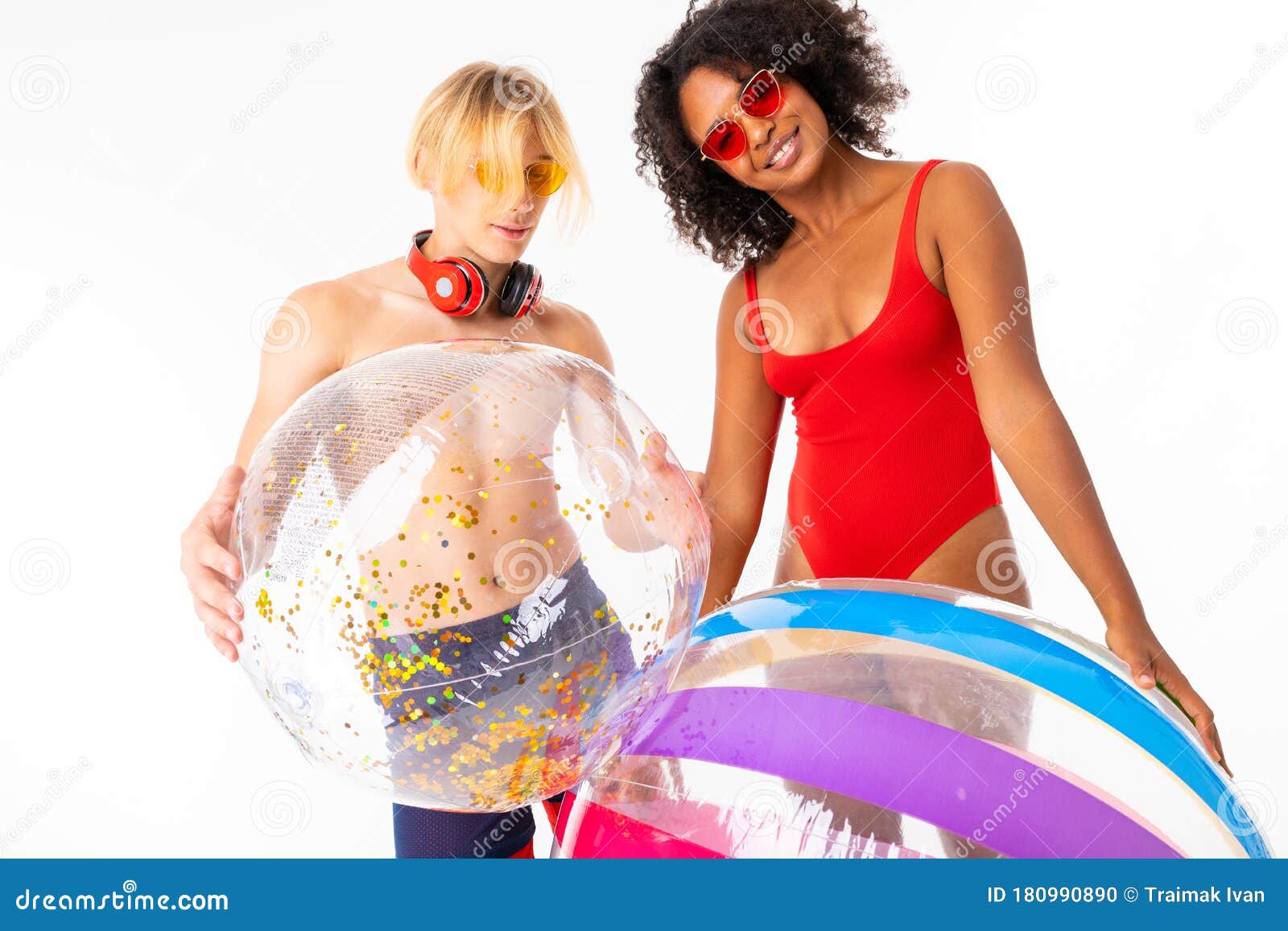 https://thumbs.dreamstime.com/z/african-female-caucasian-blonde-man-stands-swimsuit-big-rubber-balls-smiles-isolated-white-african-female-180990890.jpg