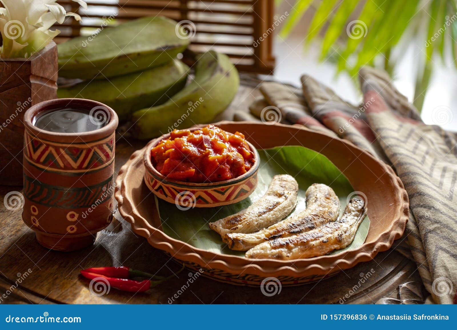 african food. african cuisine called boli and sauce. fried bananas plantains. grilled bananas. african tourism