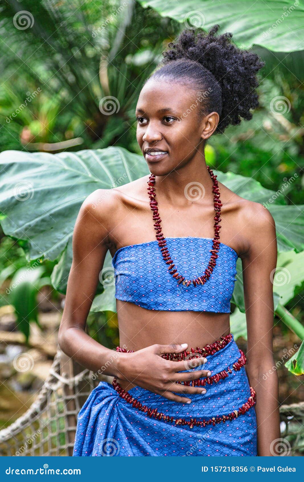 African Girl In National Clothing In Green Jungle Stock Photo - Image of jungle, jewelry: 157218356