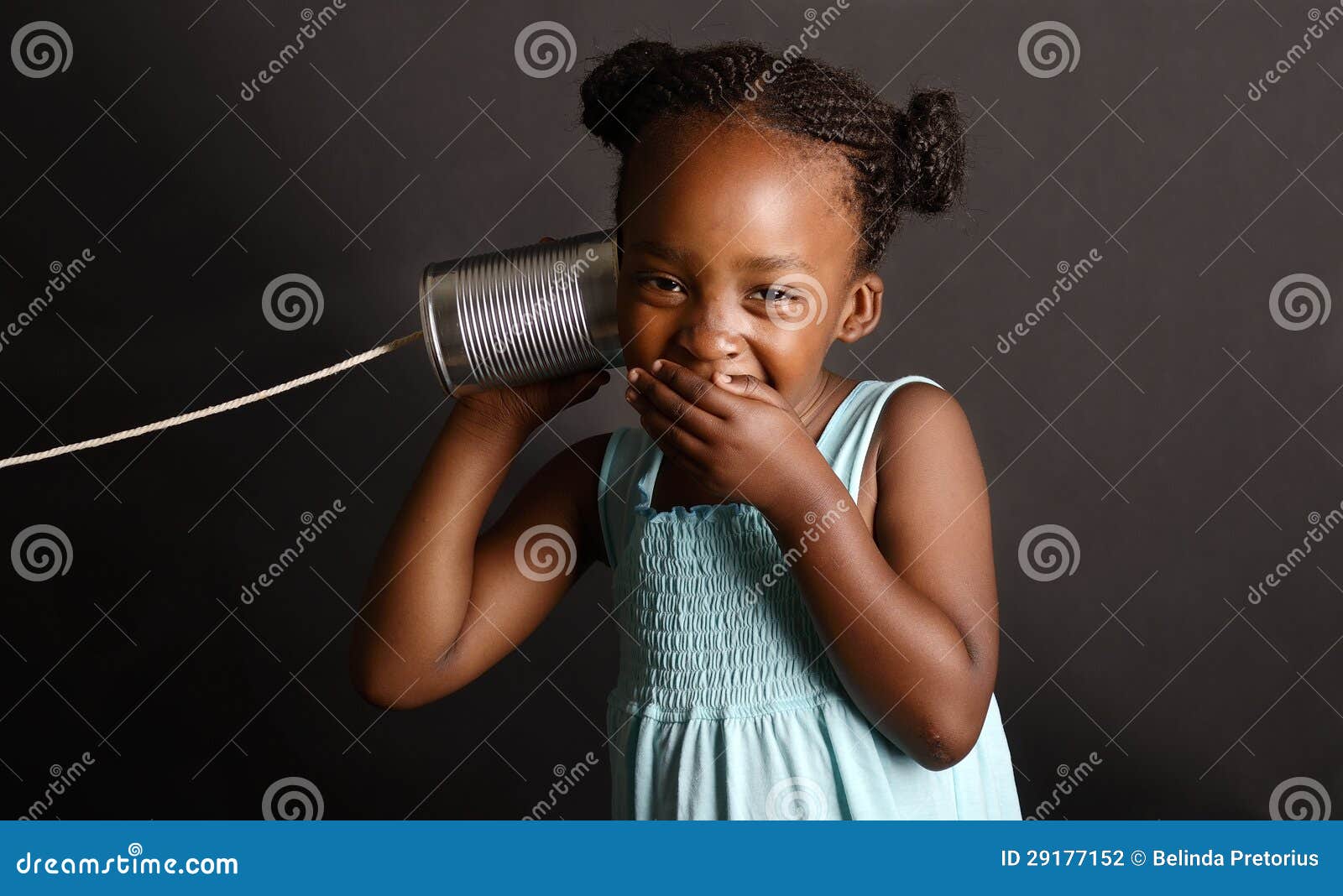 african girl with a tin and string on her ear
