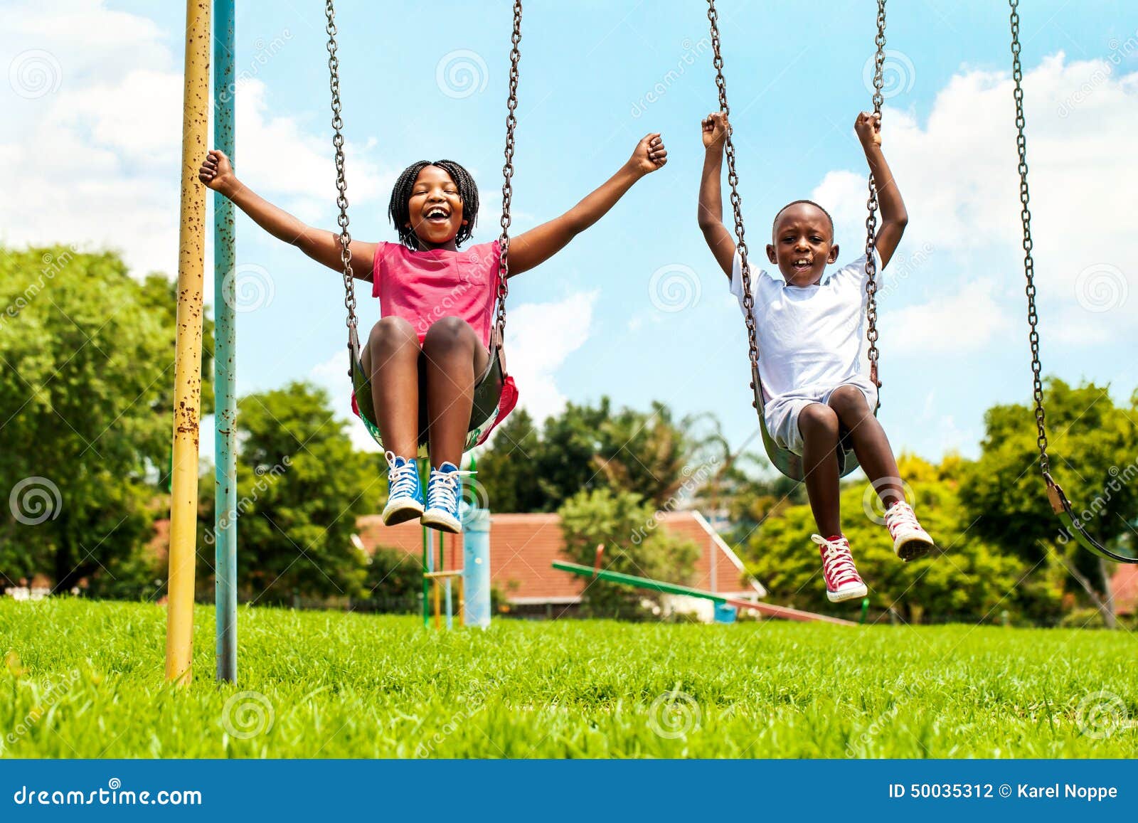 African Kids Playing On Swing Neighborhood. Stock Photo 50035312 -