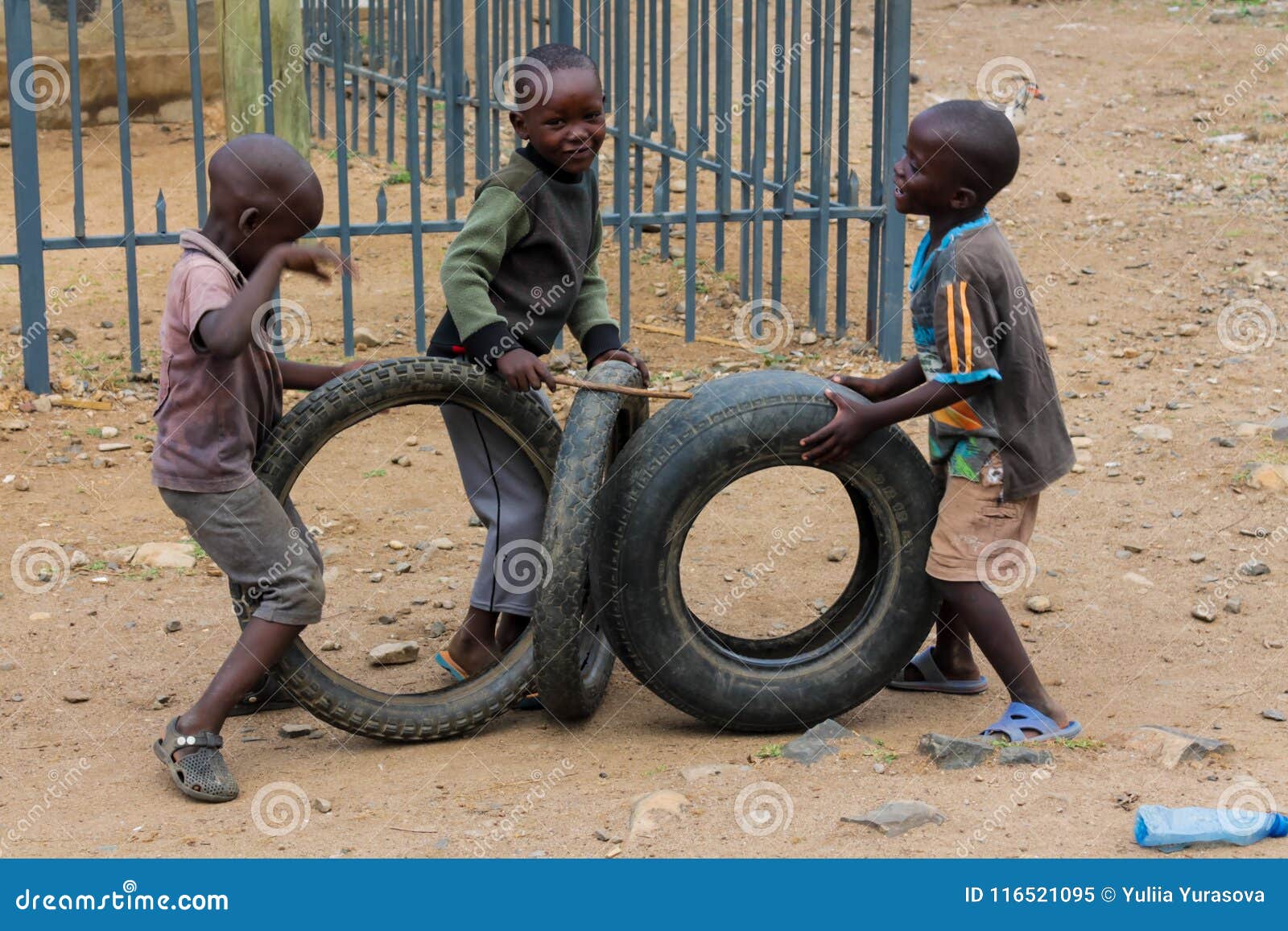 African Little Children Playing with Wheels Editorial Image - Image of  playing, fence: 116521095