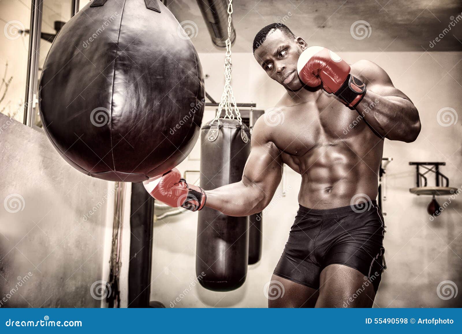 African Male Boxer Punching Ball Wearing Boxing Stock Photo - Image of  muscle, punching: 55490598