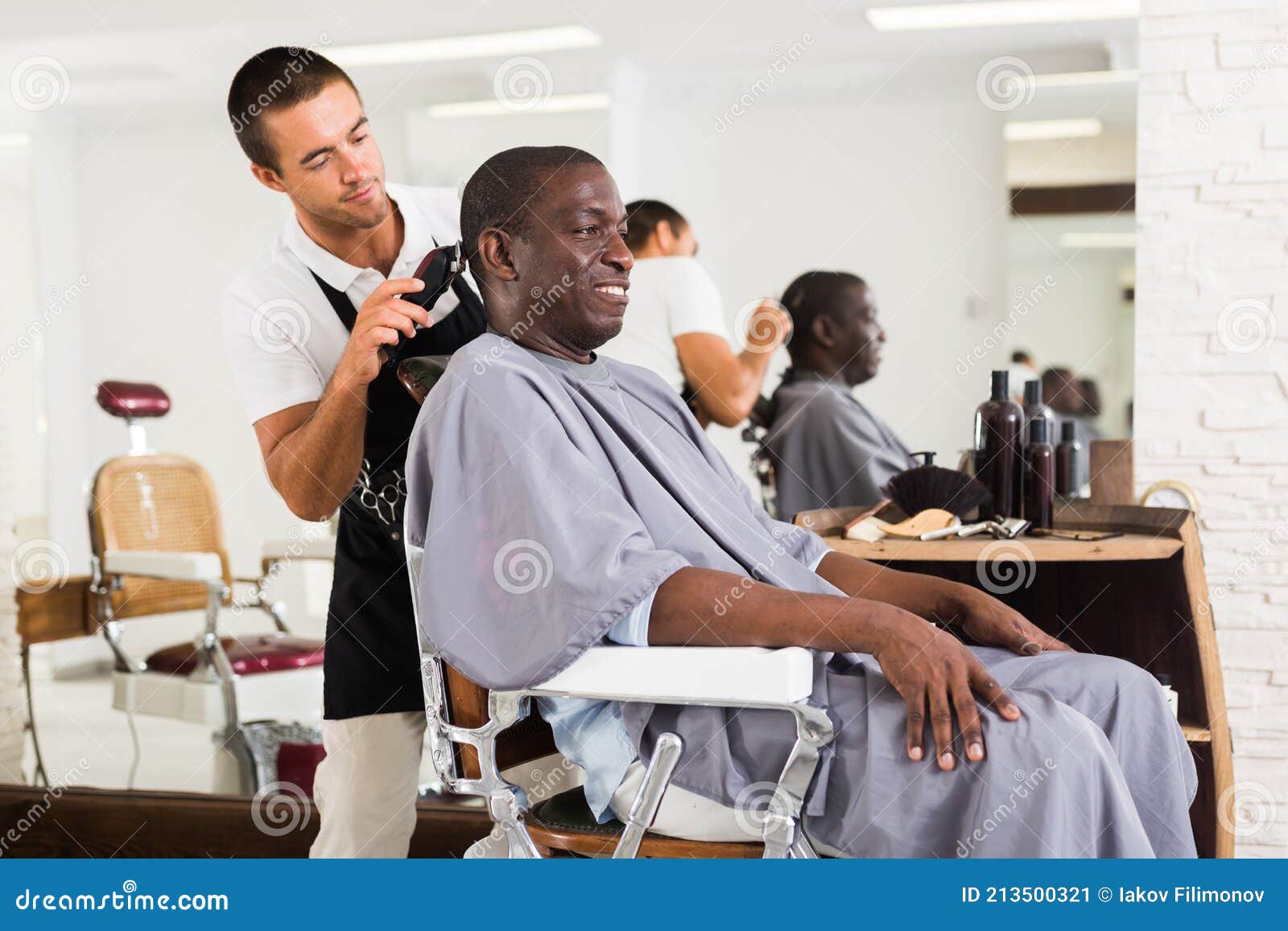 A Barber is Going through the Electric Cutting and Shaving Machine for the  Beard of an African-American Brazilian Boy Stock Image - Image of beauty,  business: 214303807