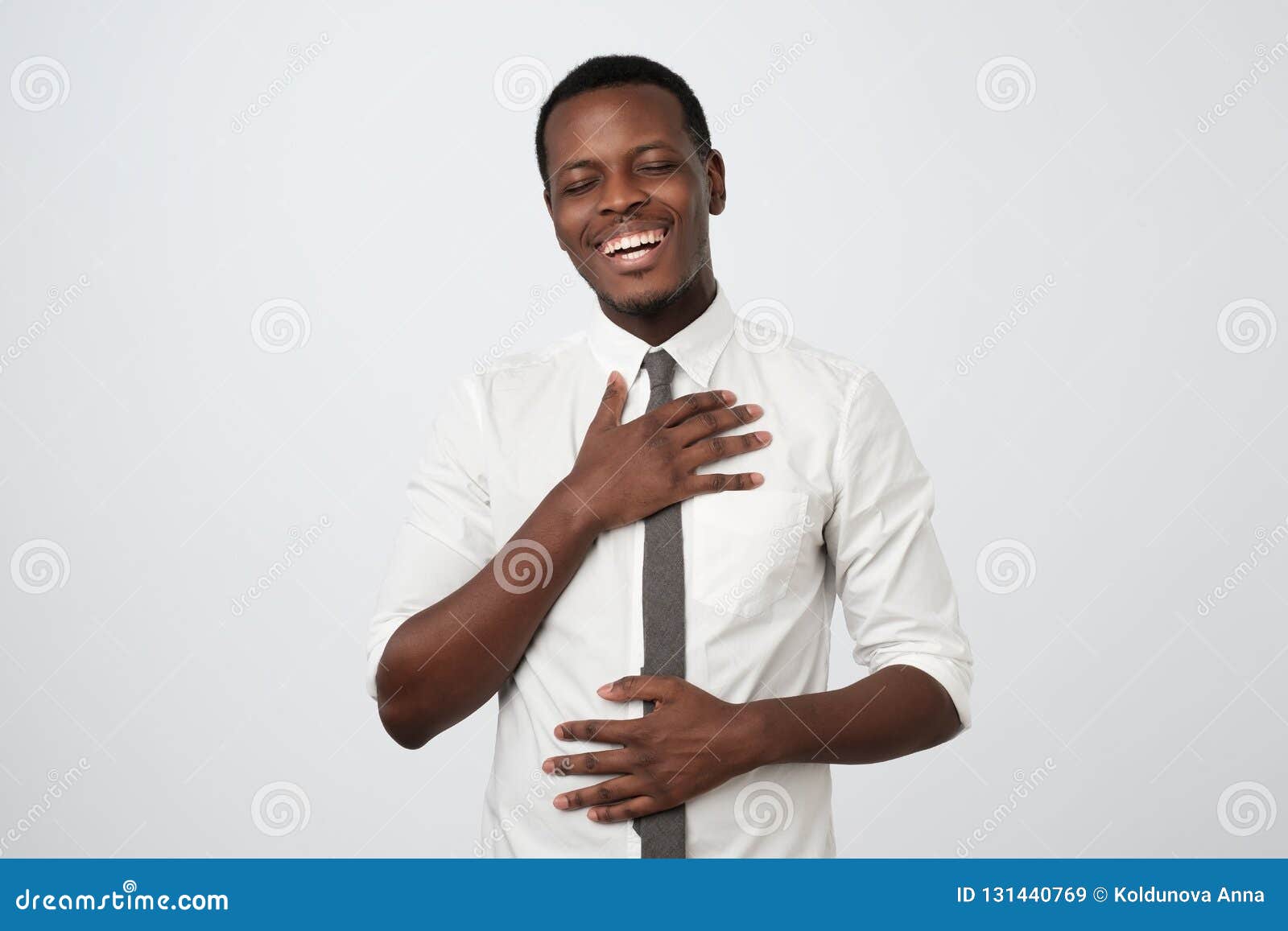 African Man Laughing Out Loud At Funny Meme Or Joke He Found On