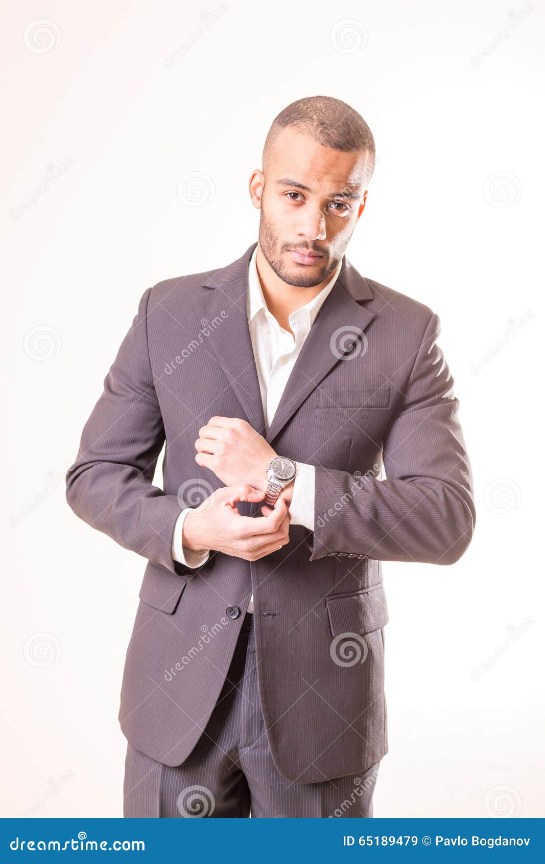 african man in suit with handwatches