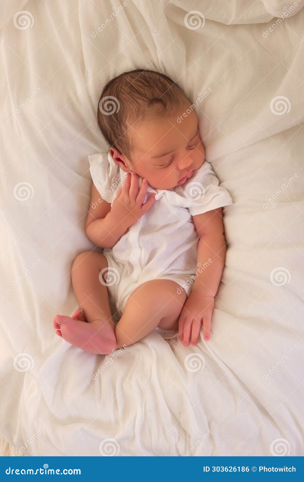 african newborn baby in white romper