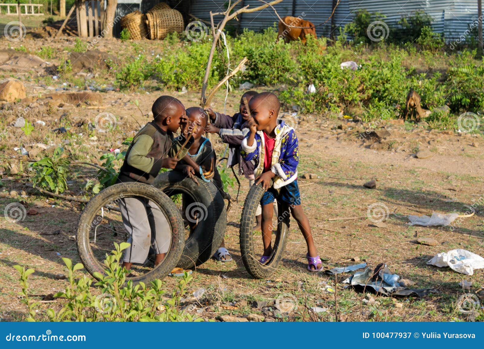 African Poor Boys Play with a Wheel Editorial Photography - Image
