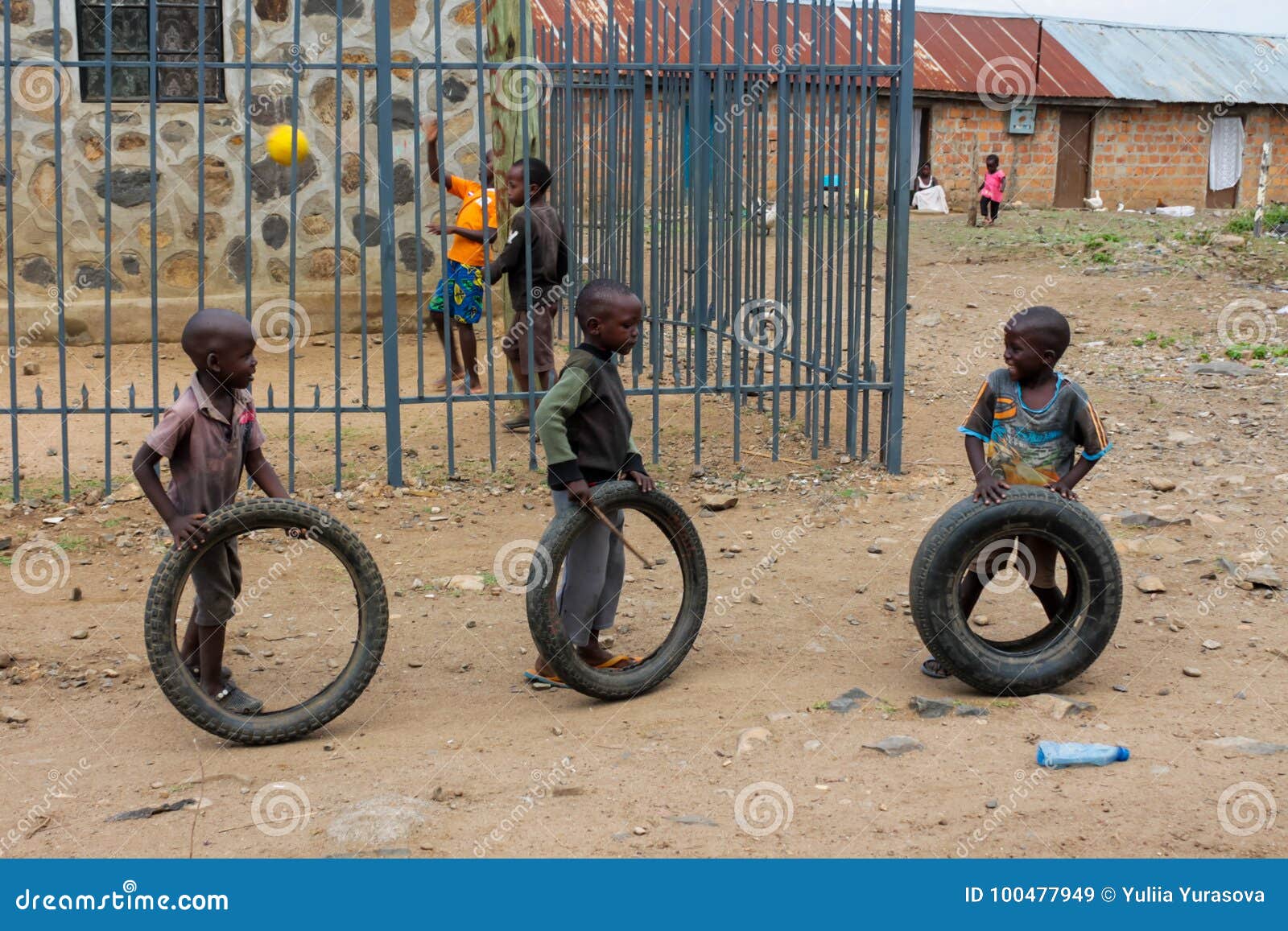 African Poor Boys Play with Wheels Editorial Stock Image - Image