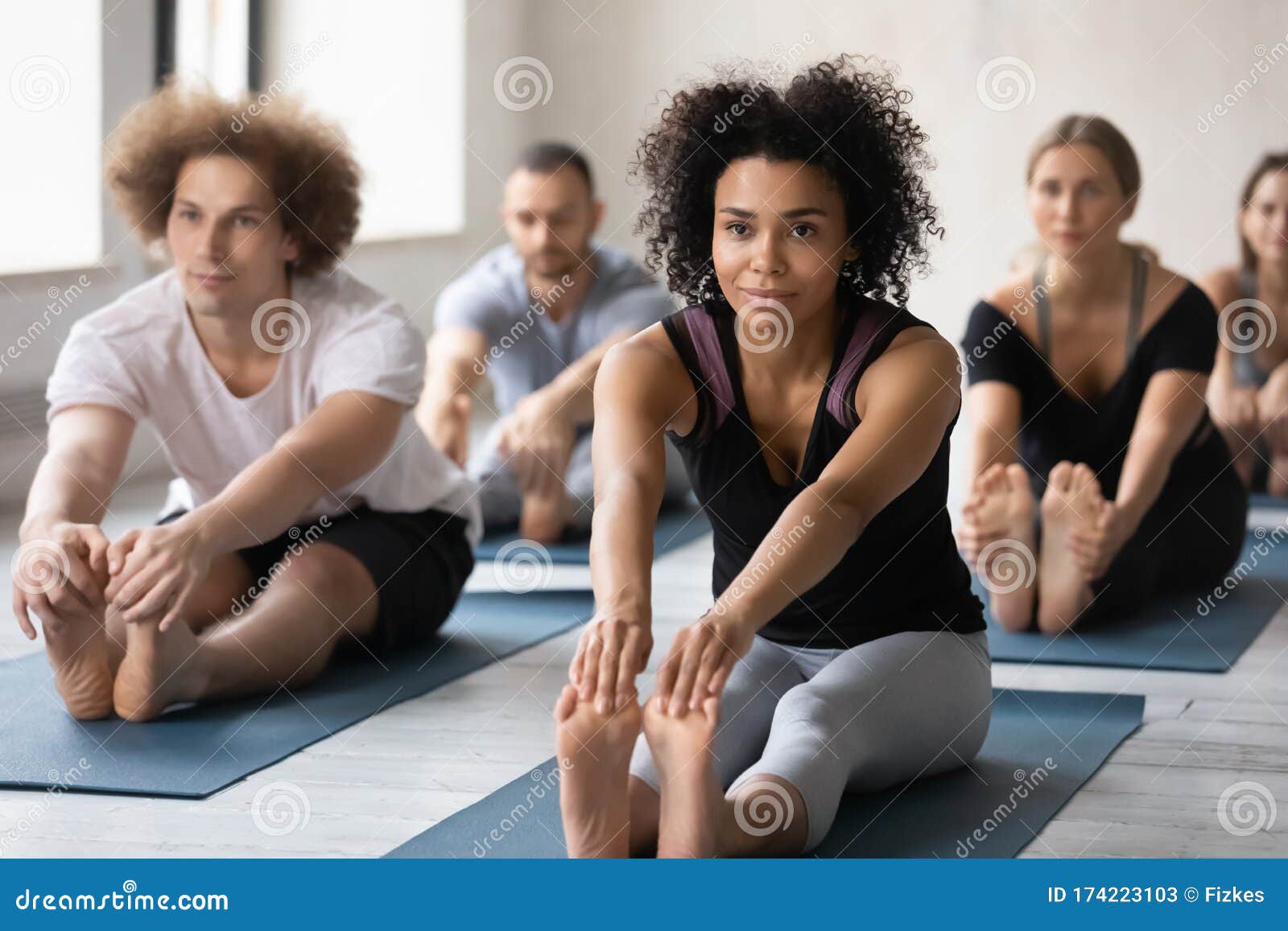 African Woman and Associates Gather Together for Yoga Training Stock Image  - Image of fitness, bend: 174223103