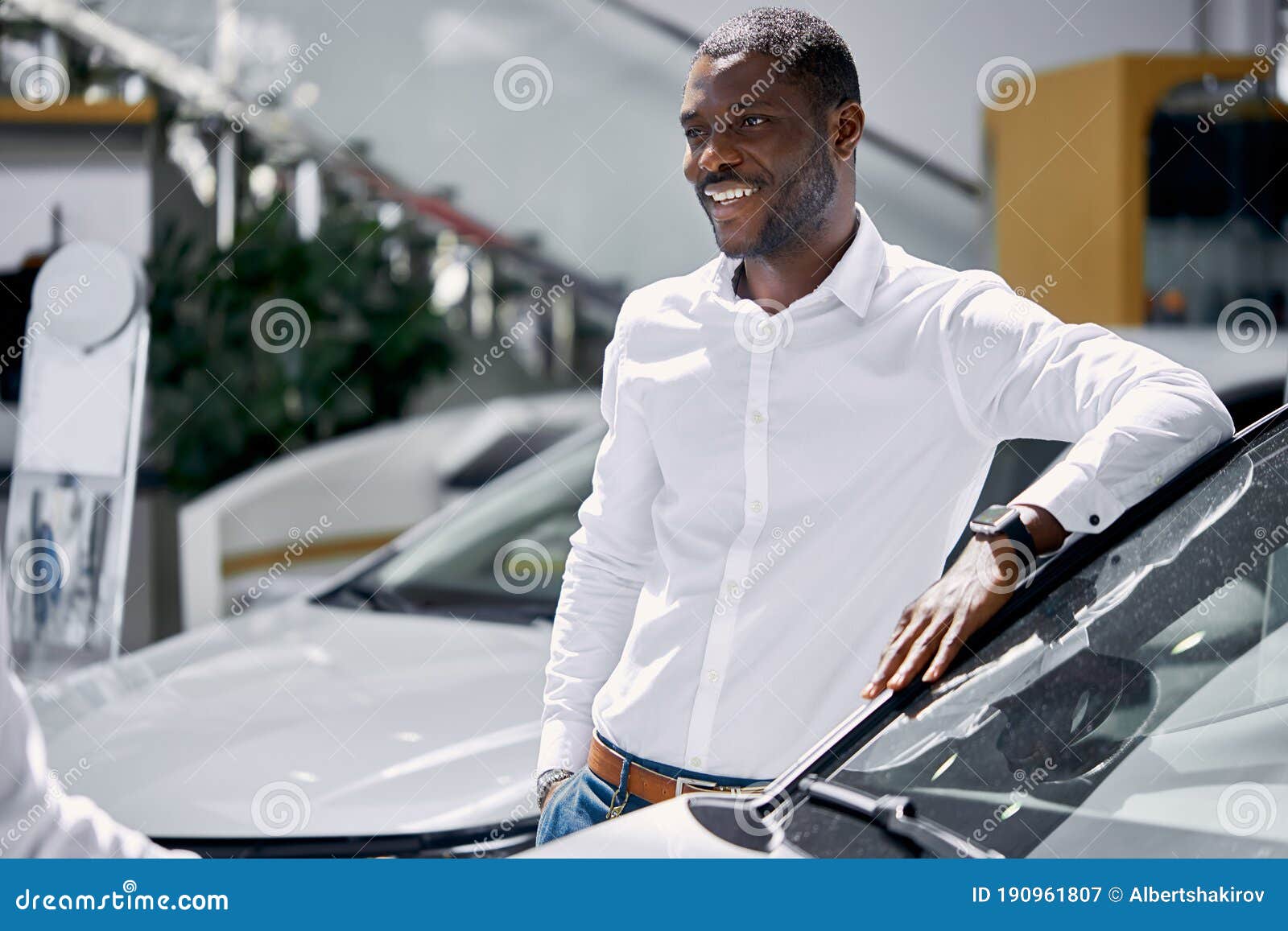 africanamerican man came to see automobiles in dealership