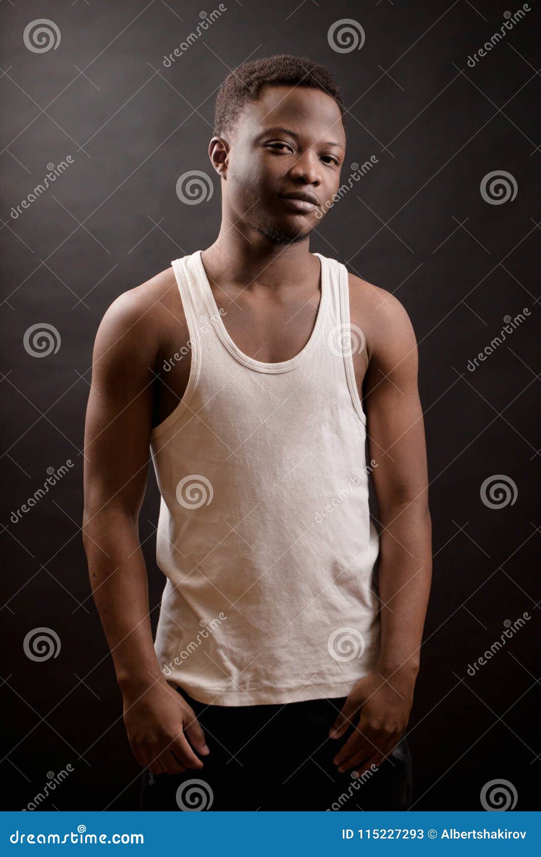 africanamerican young male with athletic body  on the black background