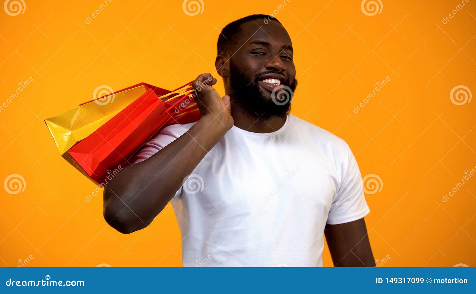 Afro-American Man Holding Shopping Bags and Smiling at Camera, Season ...