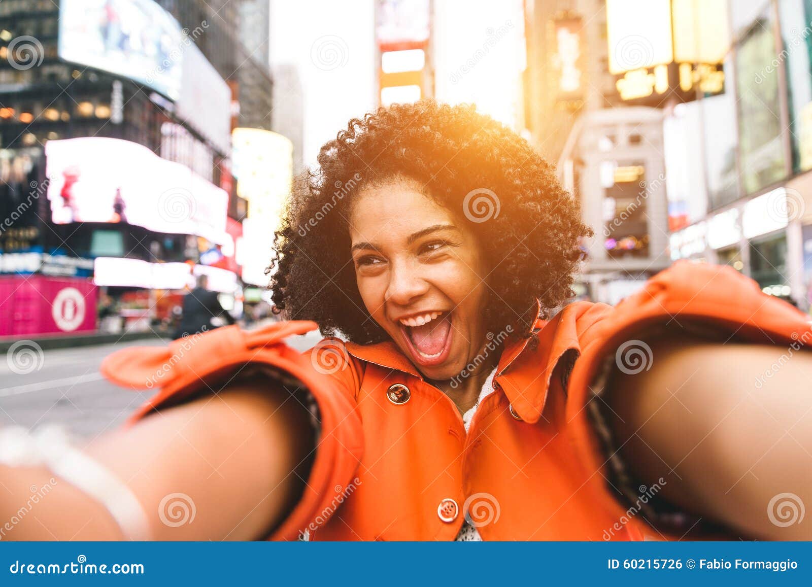 afro american woman taking selfie in time square, new york