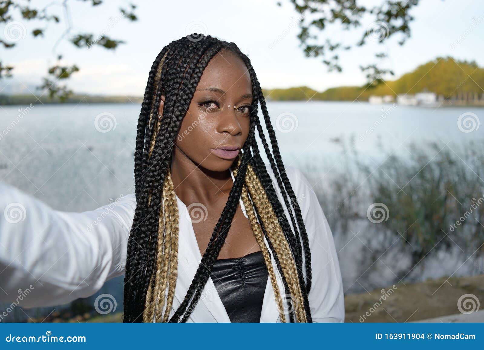Afro Black Girl Takes A Selfie With Long Black And Blonde Braids With A Lake In The Background Stock Photo Image Of Authentic Lady 163911904