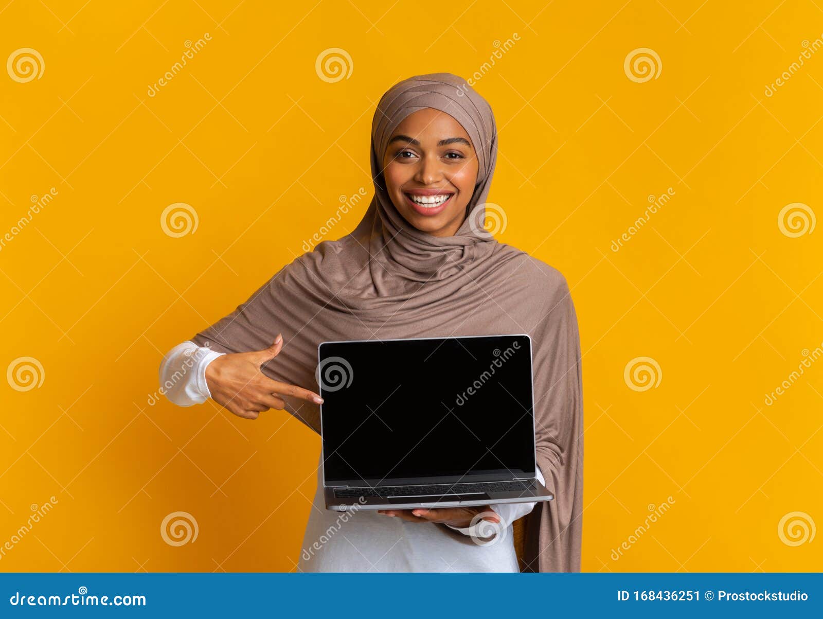Afro Muslim Girl In Headscarf Holding Laptop Computer With Black Screen Stock Image Image Of Girl Looking 168436251