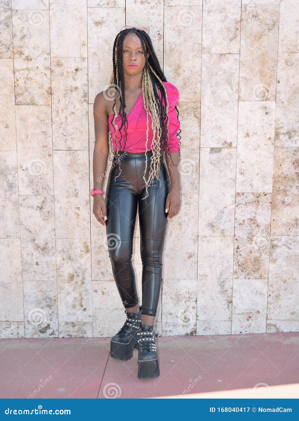 Afro-style Black Girl with Long Black and Blondes Braids Wearing Big Shoes, Leather  Pants and Sunglasses Rests on a Wall and Looks Stock Image - Image of  lipstick, laugh: 168040417