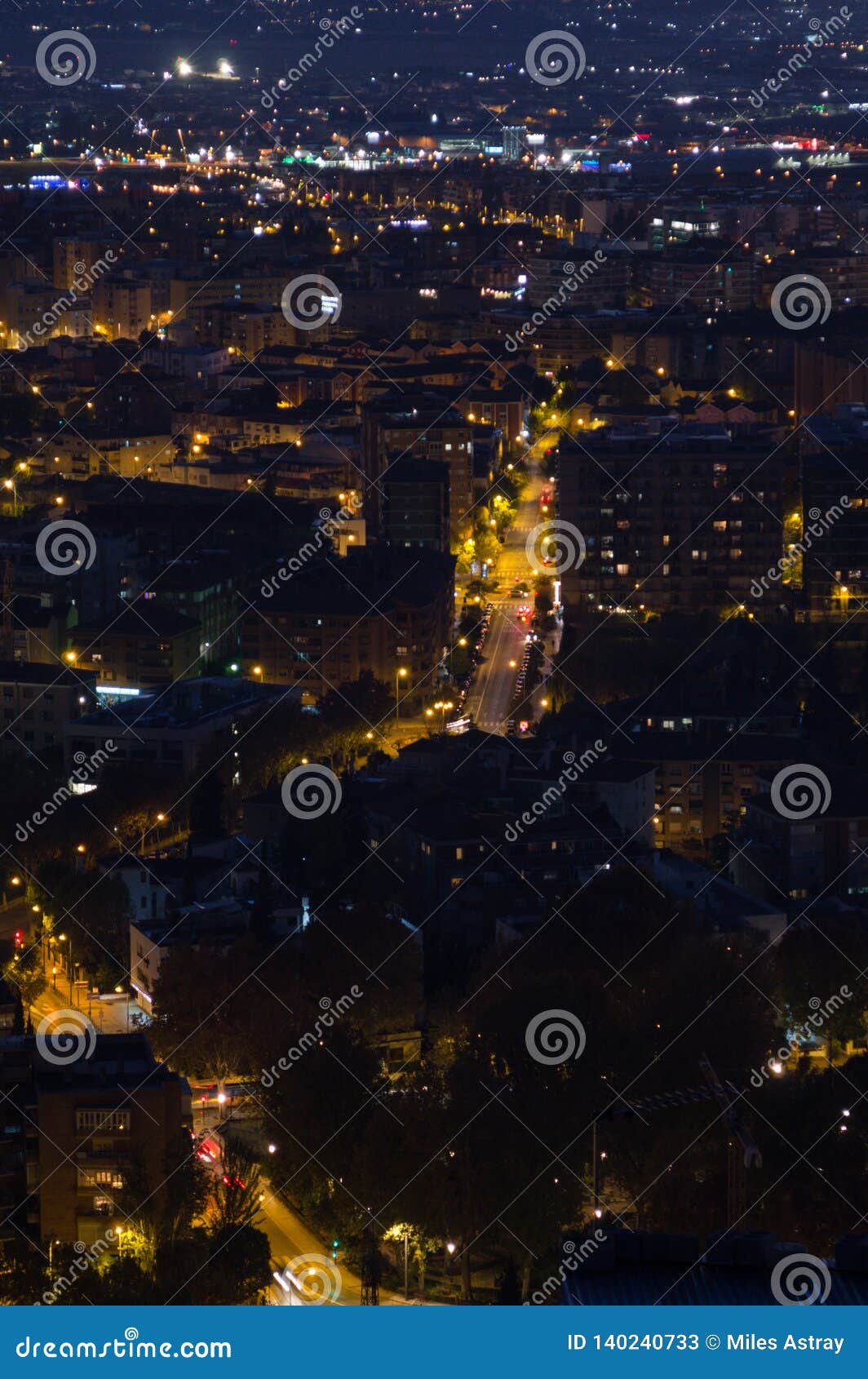 afterglow with cityscape and mountains at mirador del barranco del abogado lookout in granada, spain