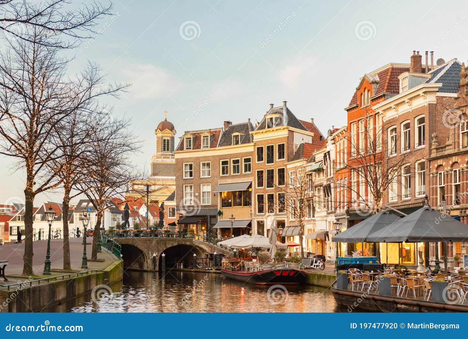 afternoon view of the nieuwe rijn canal with bridge and historic buildings in the city center of leiden