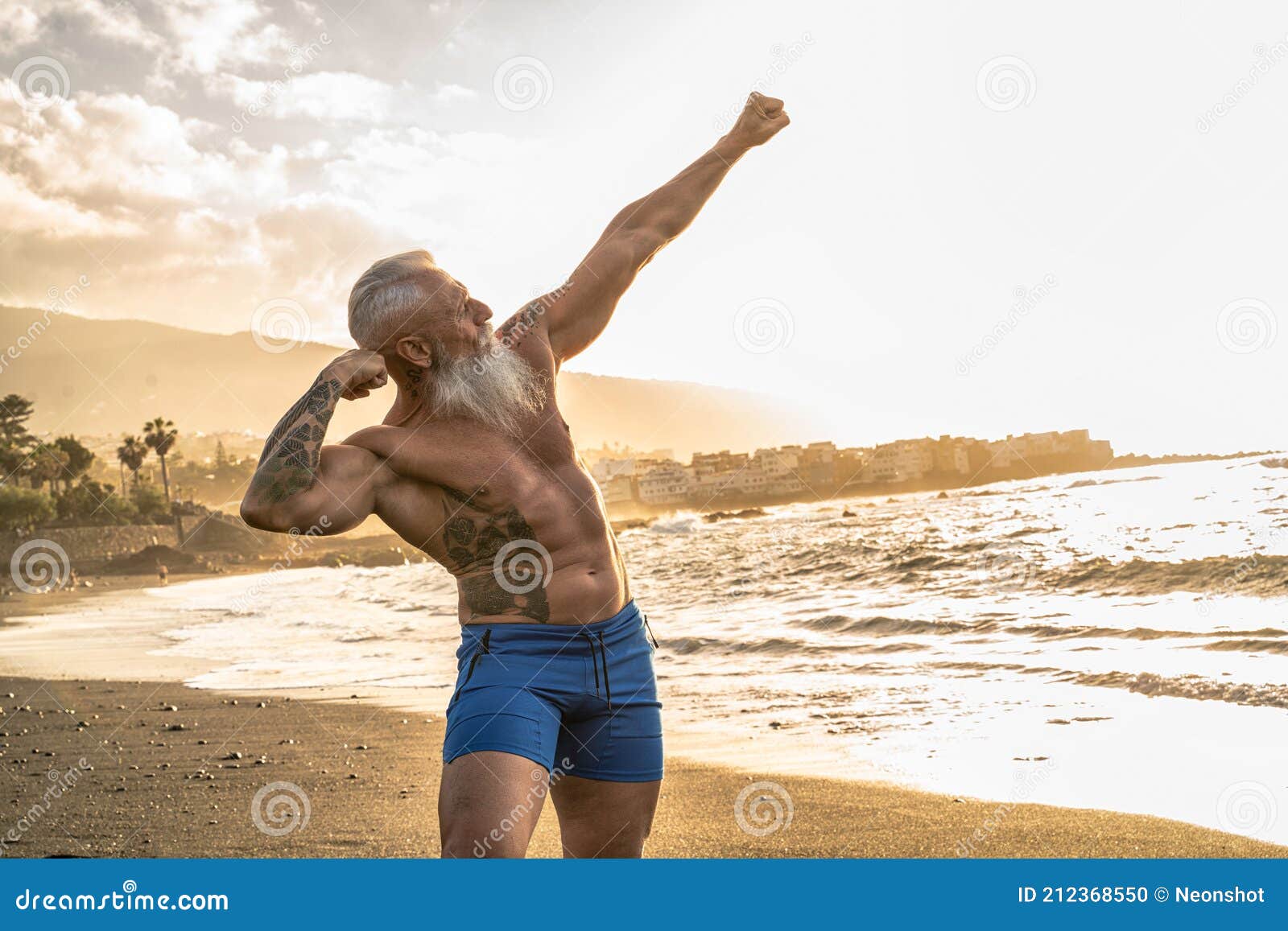 age is just a number. in a healthy body, healthy mind. senior man with white stylish beard showing his muscular fit body with