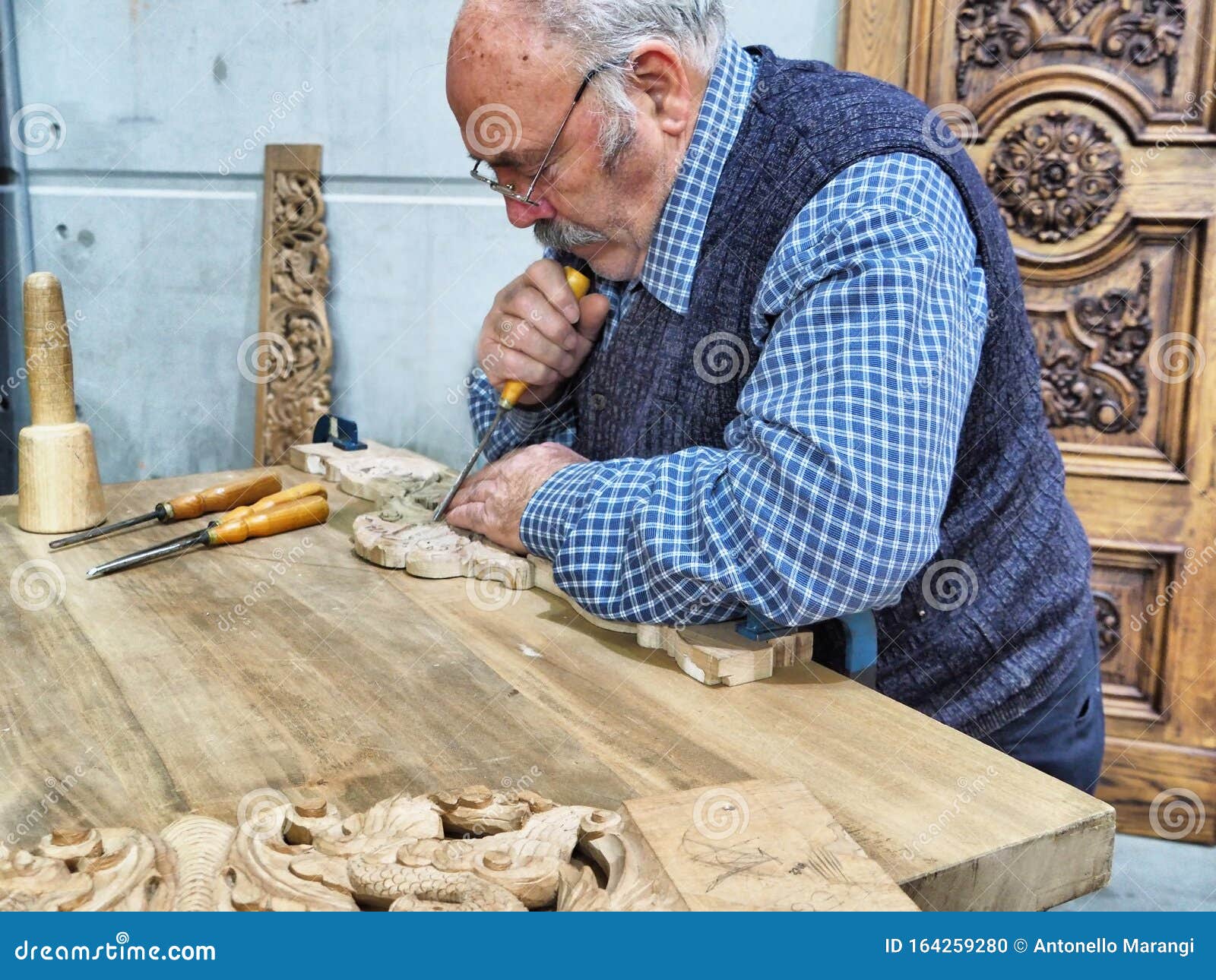 Aged Carver Craftsman at Work in His Workshop Editorial Image - Image