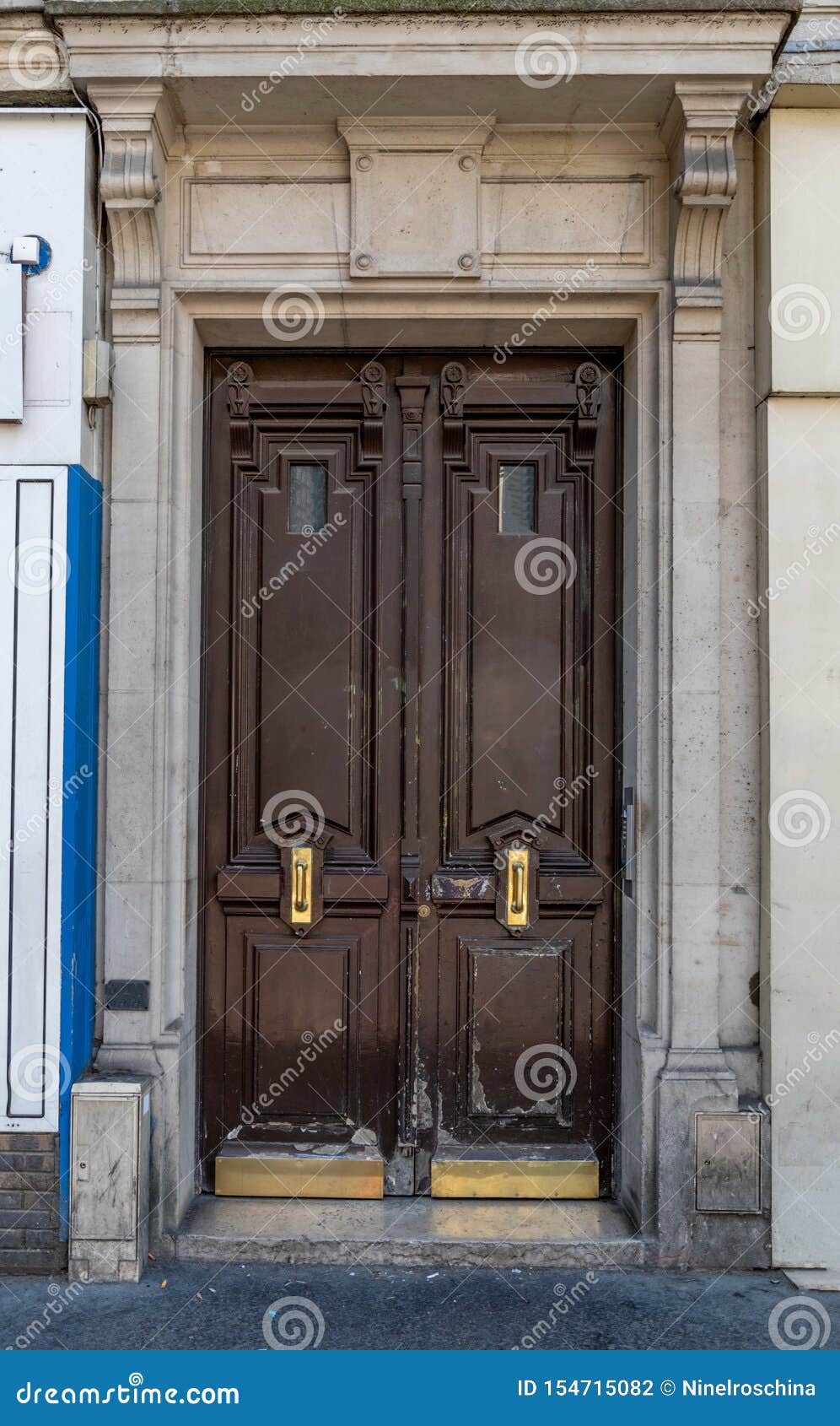 Aged Dark Wood Double Door Entrance Of Old Building In Paris